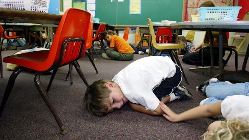 Students hiding under desks - gun violence drama